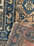 Underside view of Persian Malayer rug with low pile and soft texture underfoot.