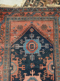 Antique village Malayer rug with aged natural dyes and navy field.