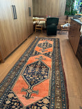 Antique Malayer runner staged in kitchen.