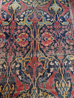 Close-up of tribal design with asymmetrical medallions on Bidjar rug.