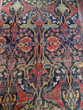 Close-up of tribal design with asymmetrical medallions on Bidjar rug.