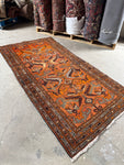 Orange Fever Persian rug from 1940, handwoven by Kurdish women.