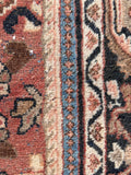 Muted vintage Mahal rug close up of border bands.