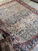 Artistic shot capturing the soulful, shabby chic character of the entire rug.