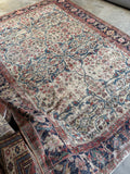 Artistic shot capturing the soulful, shabby chic character of the entire rug.
