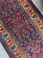 Antique Persian Bidjar rug with Herati pattern in main field and saffron yellow border with floral and paisley motifs.