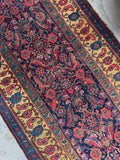Antique Persian Bidjar rug with Herati pattern in main field and saffron yellow border with floral and paisley motifs.