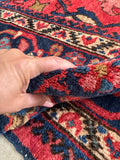 Large antique oriental rug with a fluid Art Nouveau border and rich, saturated color palette.
