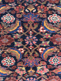 Herati fish motif Persian runner detailed photograph of the classic repeating pattern in yellow, coral, and periwinkle blue.
