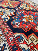 Vintage Persian rug with two central medallions.