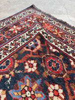 Corner of rug highlighting precise Mina Khani alignment and star border