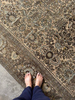 Kaleidoscope-style floral arrangement in rug pattern.