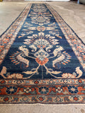 Dark blue skinny runner rug photographed flat to emphasize its rare, elongated narrow dimensions.
