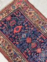 Vegetable dyed wool Persian Kurdish rug in rich colors.