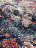 Close view of handwoven Malayer rug highlighting natural dye coloration and low pile.