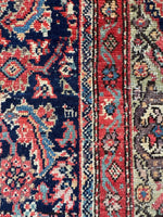 Early 20th century Mahal rug featuring stylized animal and bird motifs.