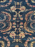 Antique 1920s Persian Mahal rug showing navy blue ground with airy design.