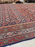 Persian wool rug over 16 feet long, ideal for hallways or dining areas.