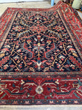 Antique navy Heriz rug that can anchor a room with strong graphic presence.