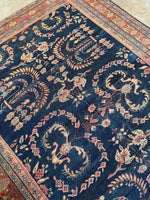Negative space highlighting the open layout of a Persian Mahal rug.