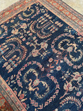 Negative space highlighting the open layout of a Persian Mahal rug.