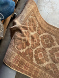 Vintage tribal runner showing tonal shift in different lighting.