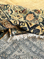 The underside of a large antique Persian Ferahan wool rug
