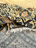 The underside of a large antique Persian Ferahan wool rug