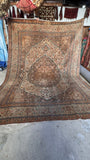 Large vintage Persian Tabriz rug measuring 8'10 x 12'5 featuring dusty rose, soft pink, ivory, and warm cocoa tones.