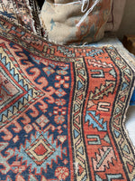 Vintage Persian rug, circa 1920s, with bold scorpion center, ram’s horn designs, and tribal geometric border.