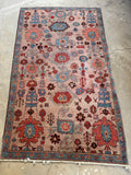 Full view of vintage Persian Heriz rug with lively color pops and tribal artistry.
