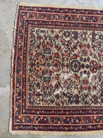 One end of vintage Persian rug.