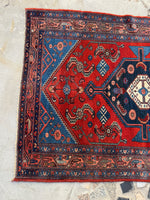 One end view of small antique Persian Malayer rug.