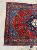 One end view of small antique Persian Malayer rug.