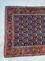 One end view of antique Persian runner.
