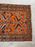 Orange abrash showing natural color variation in the wool.