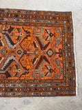 Orange abrash showing natural color variation in the wool.