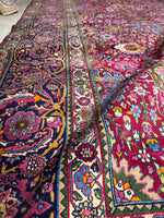 Border bands with indigo, ruby pink, and ivory floral scrolls
