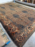 Oversize 1920s Persian Hamadan rug with rich blue tones and warm apricot field.