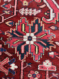 Close up of large-scale Persian Heriz carpet with luminous wool and saturated color variation.