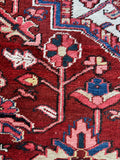 Close up of antique Heriz rug with low even pile and sturdy hand-knotted wool.