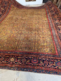 Antique Persian Mahal rug with a golden turmeric field.