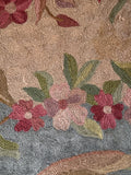 Close up of French Aubusson tapestry rug featuring full-petaled blossoms drifting across a calm blue field.