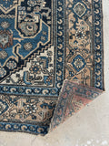 Corner view of antique Persian Malayer rug, 4'8 x 7'3, with classic village design.