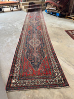 Antique Persian Bibikabad runner, supremely long with tribal design and powerful medallion motifs.