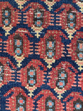 Close up view of a long wool Persian runner rug with beautifully aged character.
