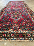 Vintage Persian wool runner with jewel tones and classic floral borders.