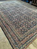 Antique Persian Ferahan Mahal rug with all over Herati fish design on a navy blue ground.
