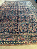 Vintage Ferahan Mahal rug featuring small scale fish and floral motifs in pink and blue.