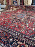 Persian Heriz rug 10x13 botanical motifs bold central medallion.